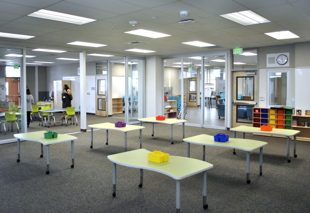 Classroom area at Mabel Mattos Elementary School featuring modern design, colorful seating, and spacious learning zones.