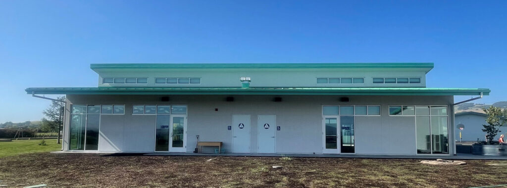 Front view of the modular classroom building at Old Adobe School, showcasing the modern design and green roof.